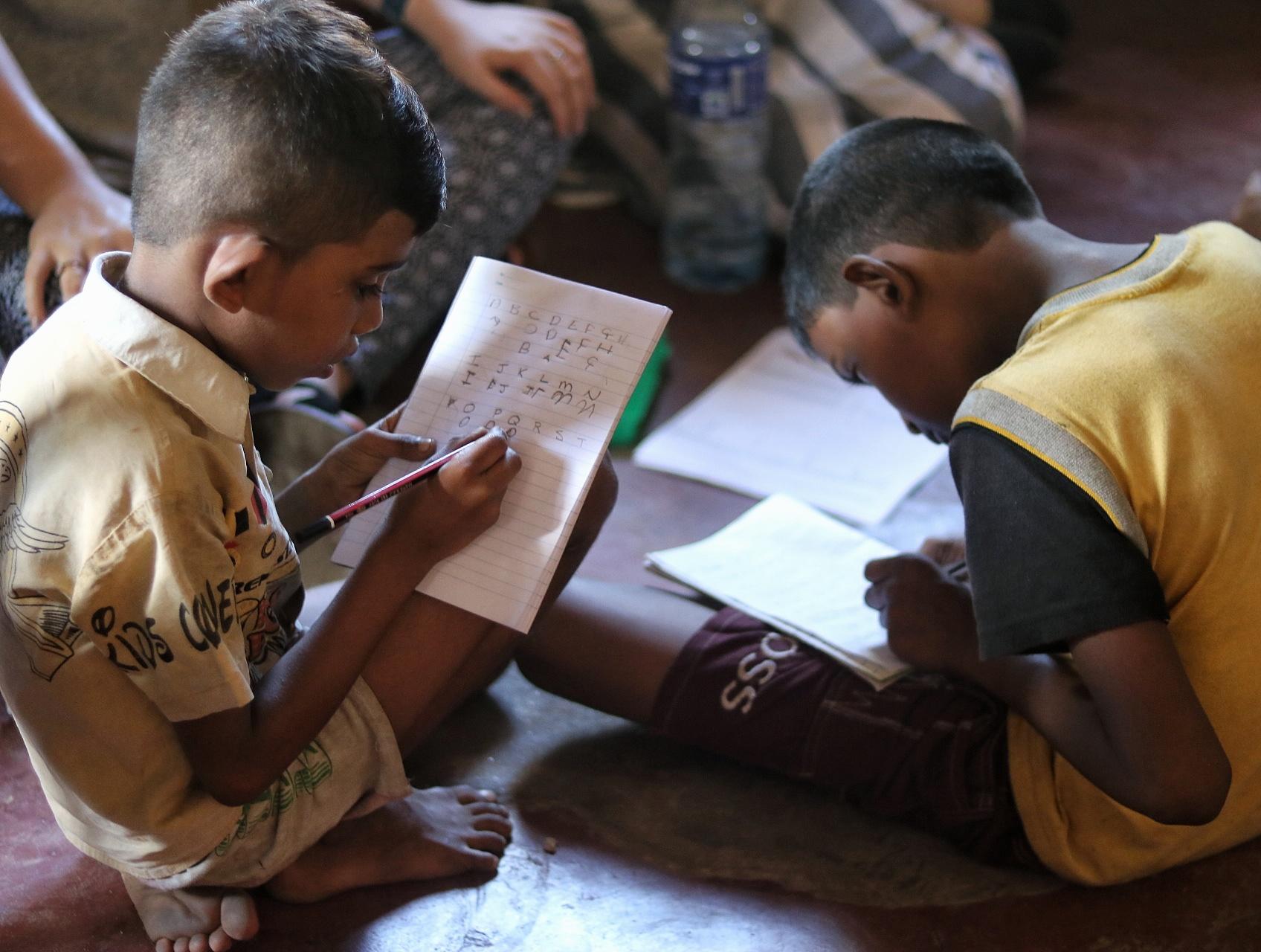 A Projects Abroad volunteer working on English activities with children in Sri Lanka on our placement for high school students A teenager works through interactive English activities while volunteering with children in Sri Lanka